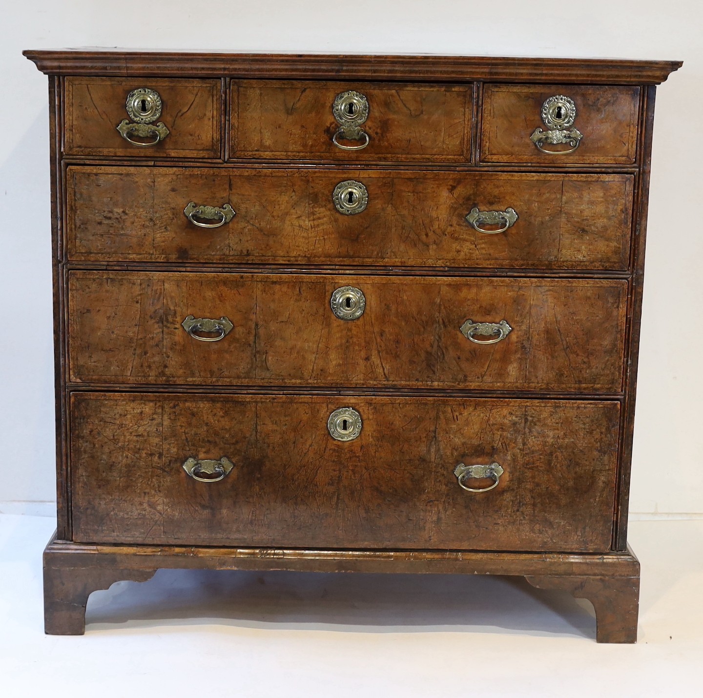 A George II crossbanded walnut chest, W.106cm D.59cm H.101cm